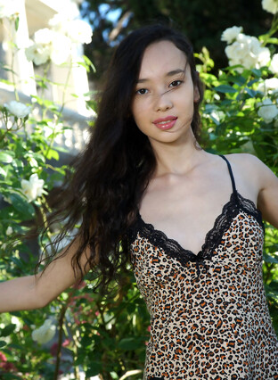 Djessy bares her petite body and trimmed pussy outdoors.